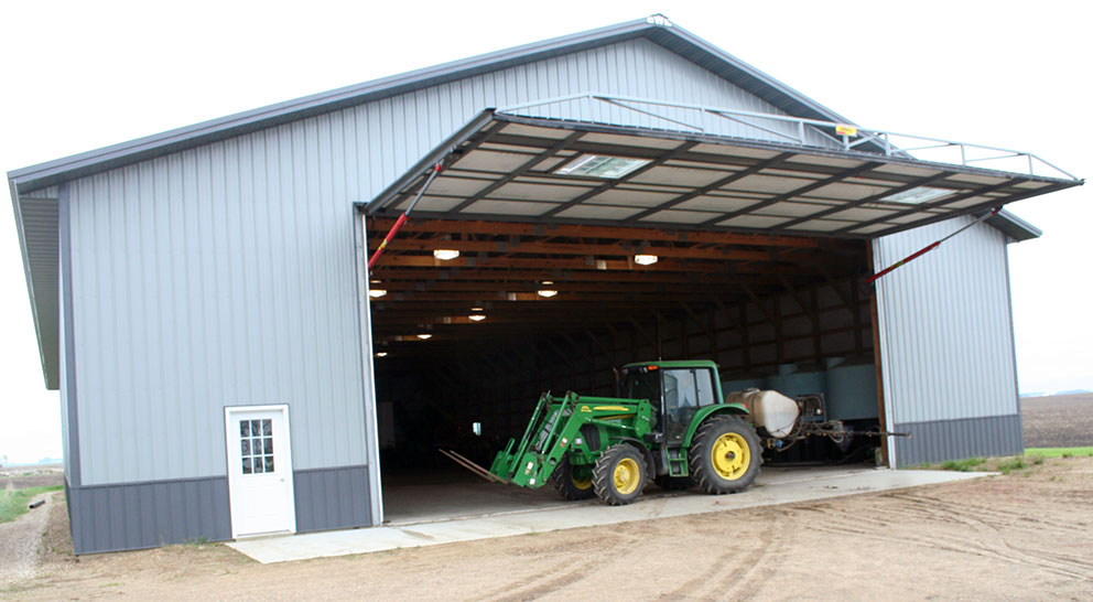 tractor inside building with open hyrdraulic door