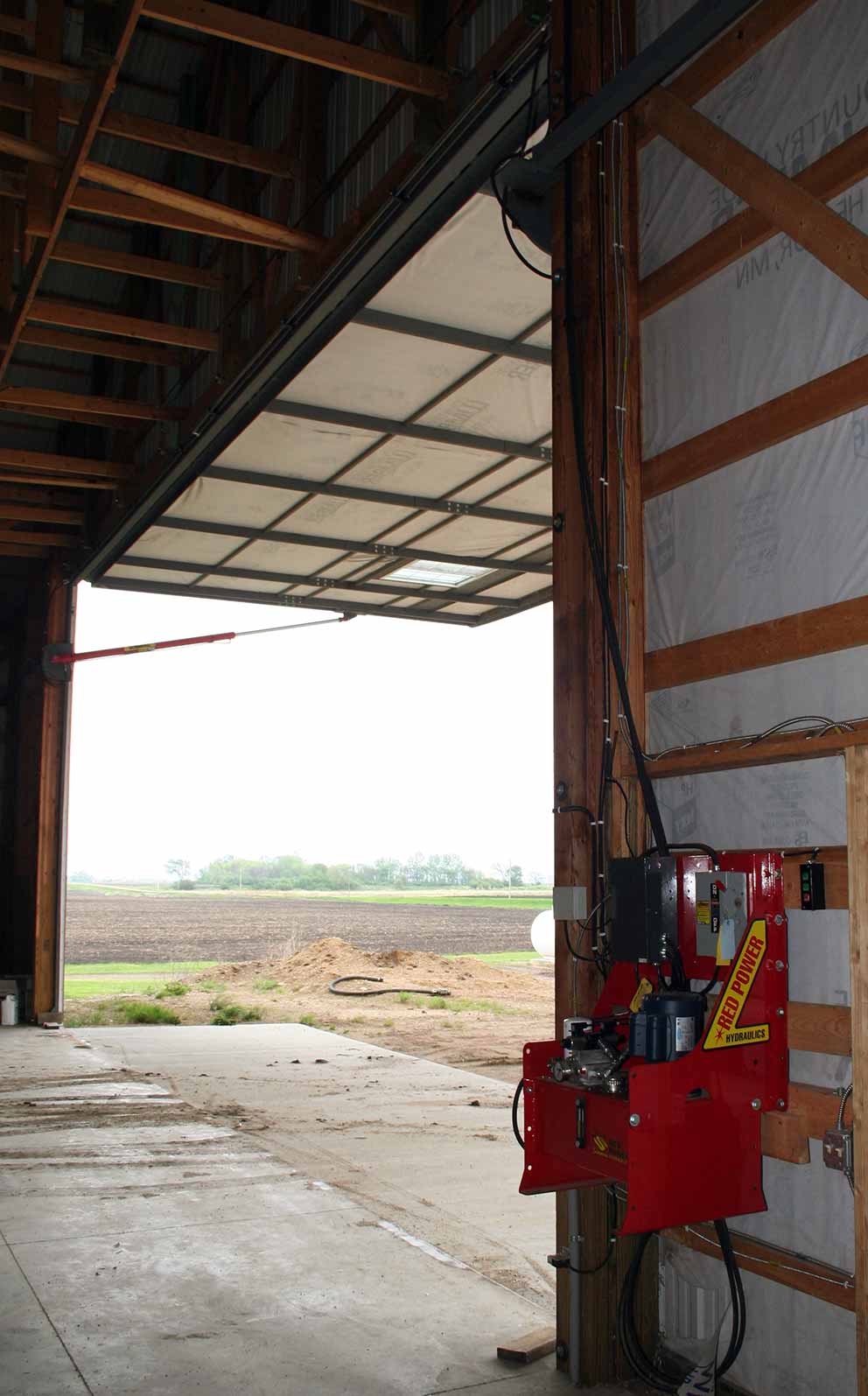 inside view of open hydraulic door showing red power pump
